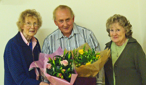 David presenting Margaret & Pat with bouquets